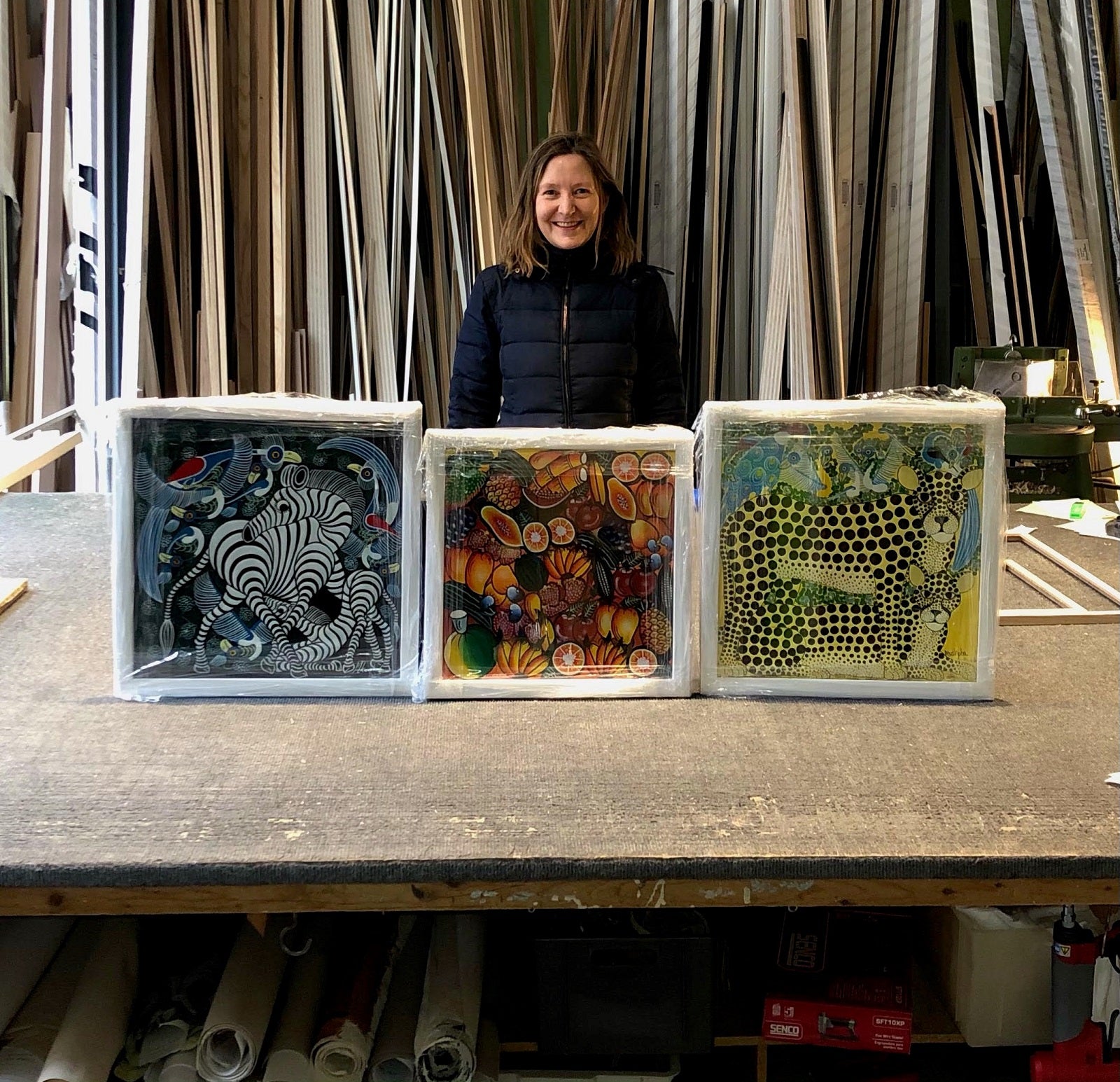 alice holding her paintings